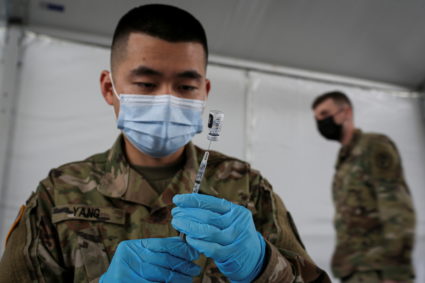 U.S. Army soldiers inoculate people with a coronavirus disease (COVID-19) vaccine in Miami
