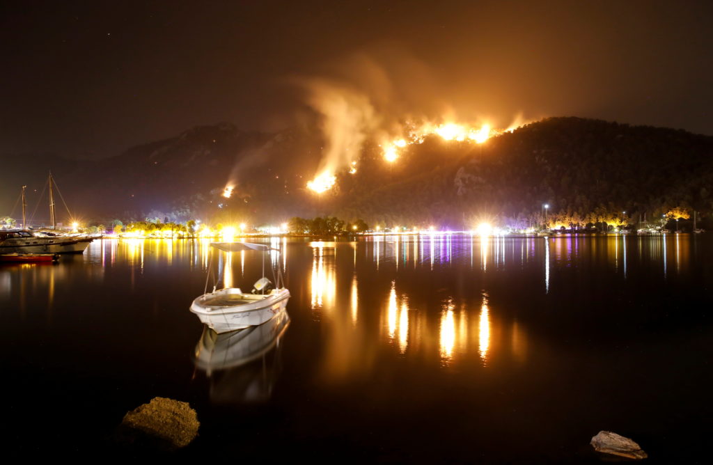 Flames and smoke rises from mountains in Orhaniye village near Marmaris