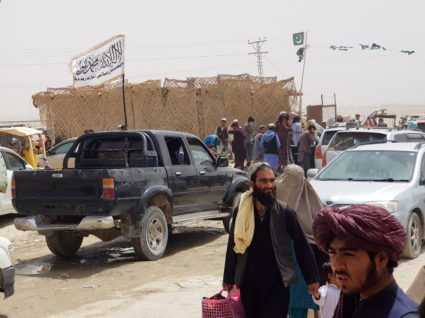 People cross Friendship Gate at Pakistan-Afghanistan border town of Chaman