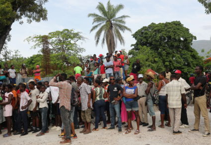 Camp Perrin residents receive food from the World Food Programme (WFP) in Camp-Perrin