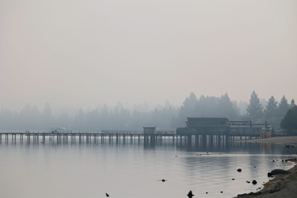 A view shows Lake Tahoe obscured by smoke from the Caldor Fire