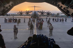 Afghan collaborators, their families, Spanish soldiers and members of the embassy board a Spanish military plane