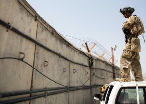 A Paratrooper assigned to the 82nd Airborne Division conducts security as evacuations continued at Hamid Karzai Internatio...