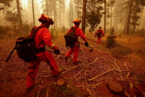 FILE PHOTO: Inmate firefighters watch for spot fires of the Dixie Fire in Westwood