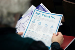 A person holds census information at an event where U.S. Rep. Alexandria Ocasio-Cortez (D-NY) spoke at a Census Town Hall ...