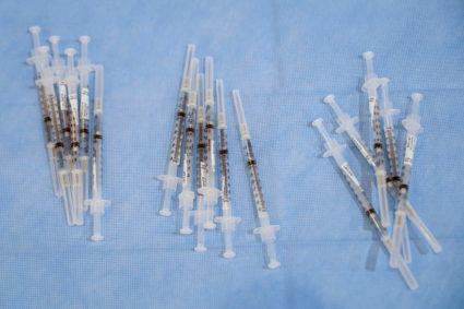 FILE PHOTO: Syringes filled with a doses of Pfizer's coronavirus disease (COVID-19) vaccine are seen at a pop-up community...