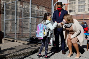 FILE PHOTO: Meisha Porter, Chancellor of the New York City Department of Education, greets students as they return to scho...