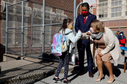 FILE PHOTO: Meisha Porter, Chancellor of the New York City Department of Education, greets students as they return to scho...
