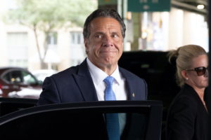 New York Governor Andrew Cuomo arrives to depart in his helicopter after announcing his resignation in Manhattan, New York...