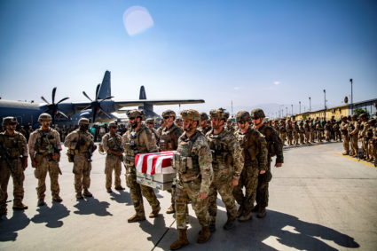 U.S. service members act as pallbearers for the service members killed in action in Kabul