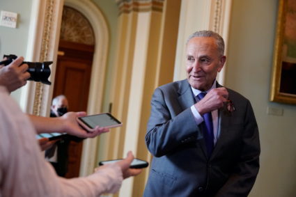 FILE PHOTO: Senate Majority Leader Chuck Schumer (D-NY) speaks to reporters at the U.S. Capitol in Washington