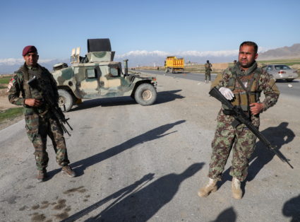 FILE PHOTO: Afghan National Army (ANA) soldiers stand guard at a check point near the Bagram Airbase north of Kabul, Afgha...