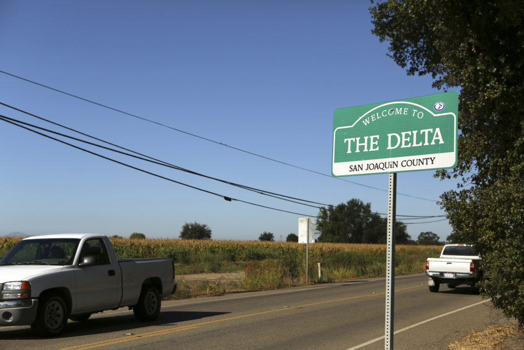 A sign is shown in the Sacramento San Joaquin River Delta near Walnut Grove, California