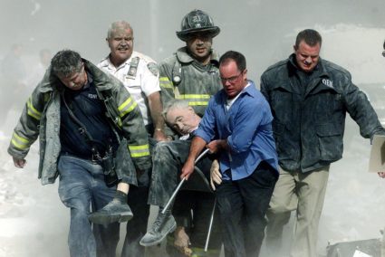 File photo of rescue workers carrying fatally injured New York City Fire Department Chaplain, Father Mychal Judge from the...