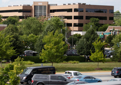 Police gather near the Capitol Gazette newspaper office where a shooting occurred in Annapolis, Maryland