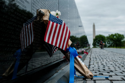 Flowers draped in flags have been left at Vietnam Veterans Memorial on U.S. Memorial Day holiday in Washington