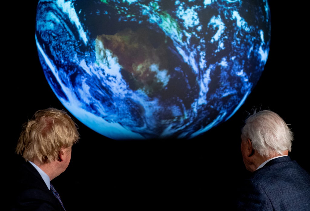 FILE PHOTO: British Prime Minister Boris Johnson and David Attenborough attend a conference about COP26 UN Climate Summit,...