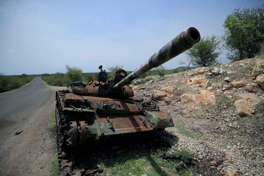 A tank damaged during the fighting between Ethiopia's National Defense Force (ENDF) and Tigray Special Forces stands on th...