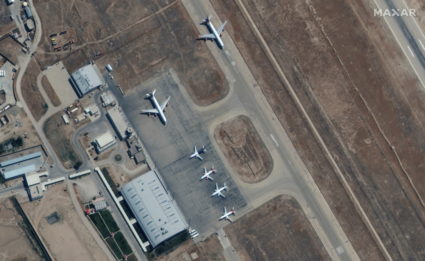 Six commercial airplanes are seen near the main terminal of the Mazar-i-Sharif airport