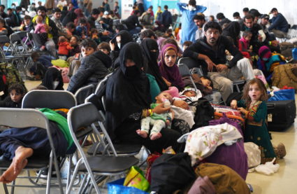 Afghan refugees are processed inside Hangar 5 at Ramstein Air Base in Germany