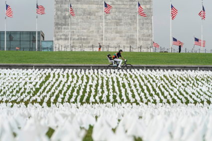 White flags representing Americans who have died of COVID-19 are placed on the National Mall in Washington