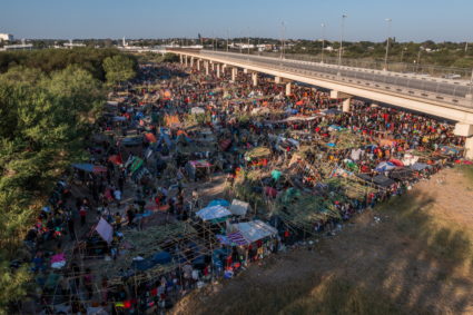 Migrants shelter near Del Rio International Bridge in Del Rio, Texas