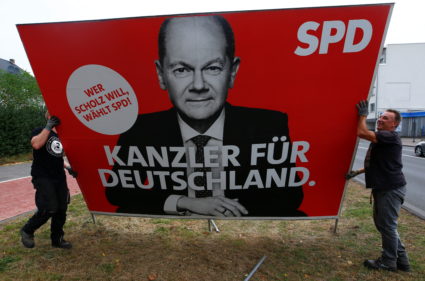Workers remove election campaign posters after general election in Germany