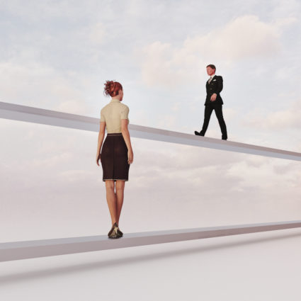 Gender inequality: man and woman on separate paths
