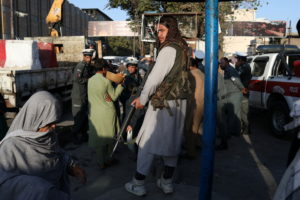 A Taliban soldier stands in one of the streets of Kabul
