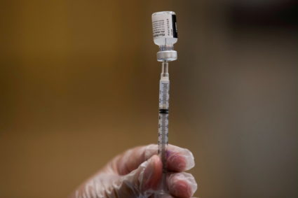 A nurse fills a syringe with Pfizer vaccine as mobile vaccination teams begin visiting every Los Angeles Unified middle and high school campus to deliver first and second doses of the coronavirus disease (COVID-19) vaccines in Los Angeles, California, U.S., August 30, 2021. Photo by Mike Blake/REUTERS