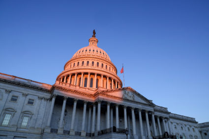 The sun rises on the U.S. Capitol dome before Joe Biden's presidential inauguration in Washington, U.S., January 20, 2021. Photo by Jonathan Ernst/REUTERS