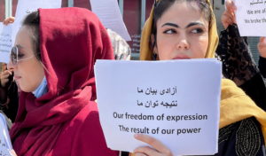Afghan women's rights defenders and civil activists protest to call on the Taliban for the preservation of their achieveme...