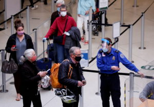 FILE PHOTO: Travelers at Seattle-Tacoma International Airport in SeaTac