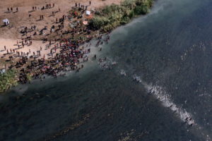 Migrants seeking refuge in U.S. cross back into Mexico