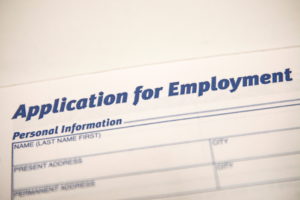 FILE PHOTO: An employment application form is displayed during a restaurant job career fair in New York