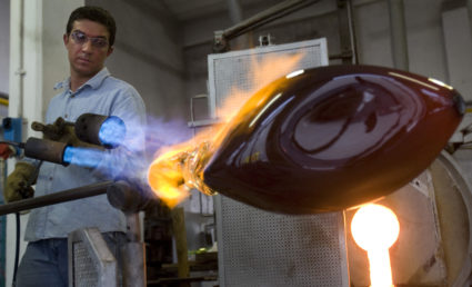 Master glassmaker Simone Cenedese uses a blowtorch on a piece of commissioned work at his family's furnace on the island of Murano near Venice January 27, 2009. Murano glass has been prized through the centuries for its refined beauty, but the credit crisis is threatening to shatter the fading Italian craft industry. Relentless competition from China and other producers and a strong euro that killed the U.S. market for its fine glass are the key culprits in cutting sales in half and the loss of about 75 percent of the sector's jobs in the last few years. But the financial crisis has dried up even the reduced sales at the glassmakers that line the canals of the Venetian island of Murano and raised stark questions about the future of the 700-year-old industry itself. Picture taken January 27, 2009. Photo by Chris Helgren/REUTERS