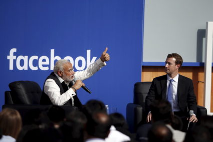 Indian Prime Minister Narendra Modi and Facebook CEO Mark Zuckerberg speak on stage during a town hall at Facebook's headq...