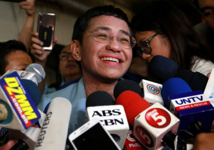 Maria Ressa, the CEO of online news platform Rappler, speaks to the media after posting bail at a Manila Regional Trial Co...