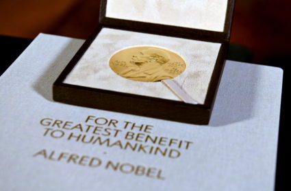 The Nobel Prize medal, presented to Charles M. Rice in Physiology or Medicine, is seen after Swedish Consul General Annika...