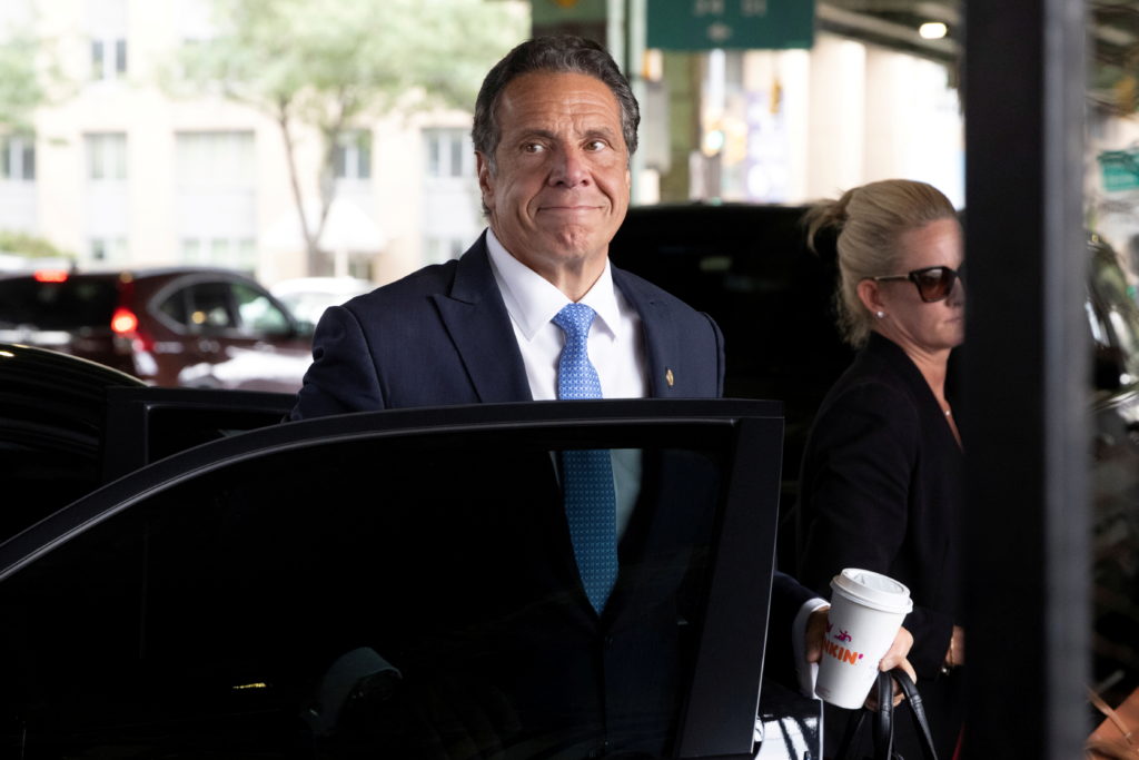 New York Governor Andrew Cuomo arrives to depart in his helicopter after announcing his resignation in Manhattan, New York...