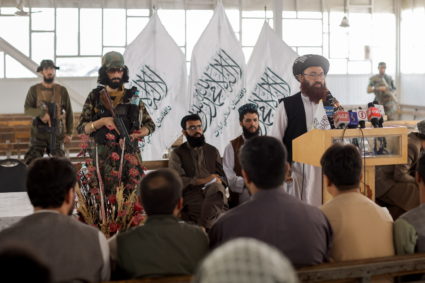 Afghanistan Taliban officials attend a news conference where they announced they will start issuing passports