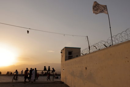 A Taliban flag is seen in a military position on a hilltop in Kabul