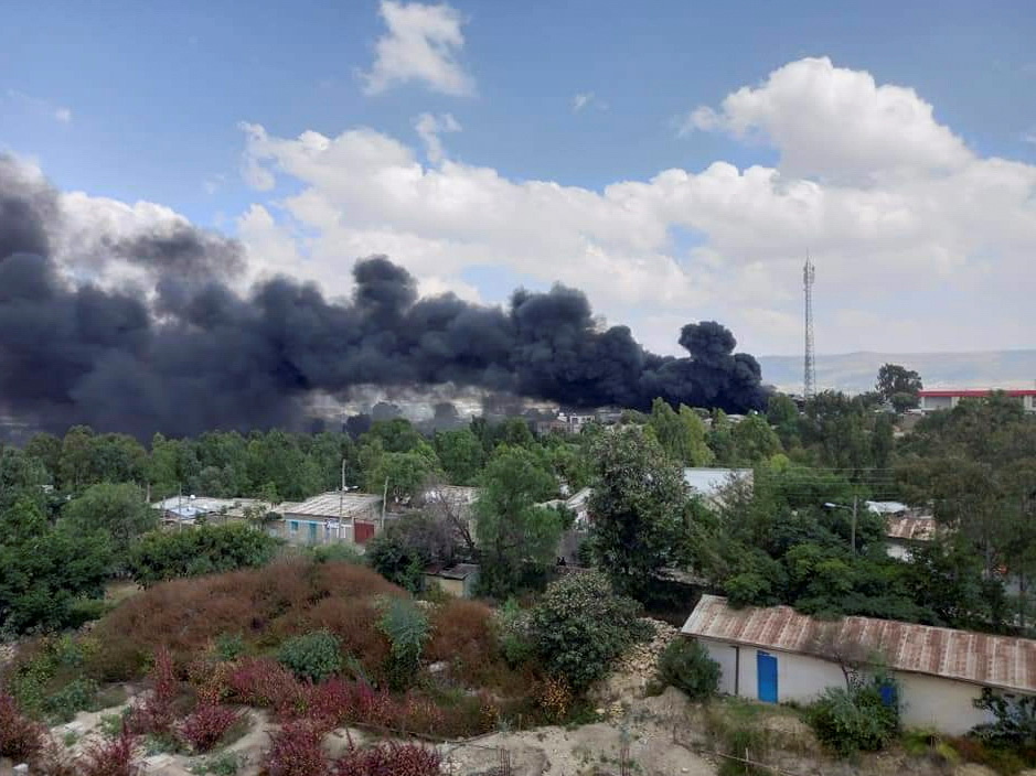 Smoke billows from the scene of an air strike, in Mekelle