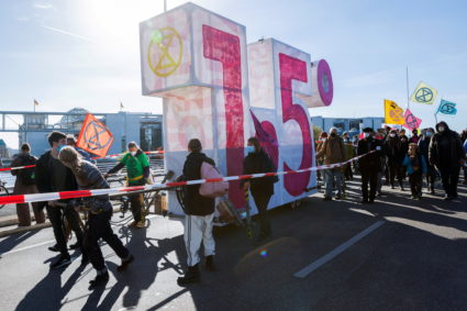 People attend a demonstration called by "Solidarisch geht anders!"(Solidarity works differently!) to demand social and eco...