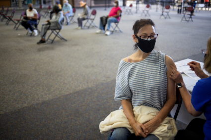 People receive COVID-19 booster vaccination in Michigan