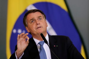 FILE PHOTO: Brazil's President Jair Bolsonaro attends the ceremony for the Modernization of Occupational Health and Safety...