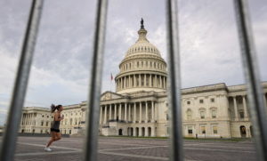 A jogger passes the U.S. Capitol in Washington
