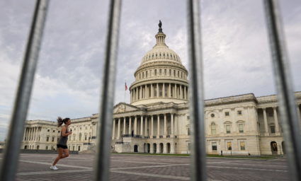 A jogger passes the U.S. Capitol in Washington