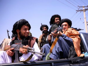 FILE PHOTO: Taliban forces patrol in front of Hamid Karzai International Airport in Kabul