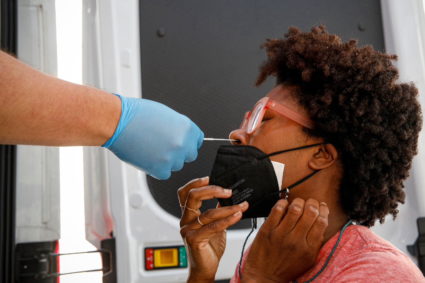 Akyiaa Wilson receives a coronavirus disease (COVID-19) test at a mobile testing van in New York
